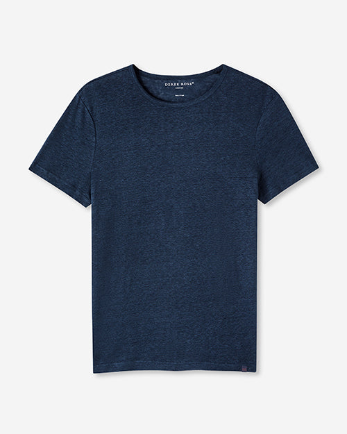 A full view of a navy crewneck t-shirt, with the words "DEREK ROSE" printed on the inner neckline. The background is plain white.