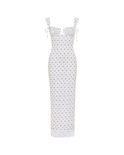 A long white form-fitting dress with thin straps and shoulder bows, featuring an empty space design at the chest, and a colorful pattern with a small blue scattered pattern.
