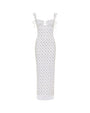 A long white form-fitting dress with thin straps and shoulder bows, featuring an empty space design at the chest, and a colorful pattern with a small blue scattered pattern.