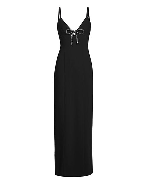 A long black gown with thin shoulder straps, and a deep V-neckline adorned with a decorative bow at the center. The background is plain white.