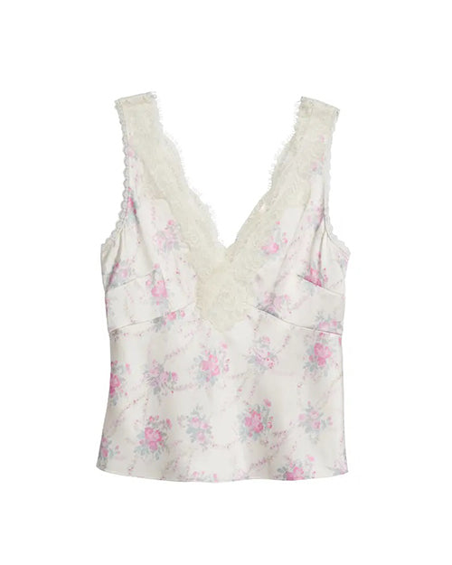 A white floral-patterned tank top adorned with pink flowers, a V-neck, and delicate lace trim with scalloped edges along the neckline and straps. The shirt is placed against a white background.