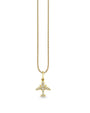A gold chain necklace with a gold airplane pendant adorned with jewels. The background is plain white.