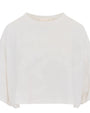 A close-up frontal shot of a cropped white; loose-fitting top placed against a white background. The sleeves are about the same length as the body.