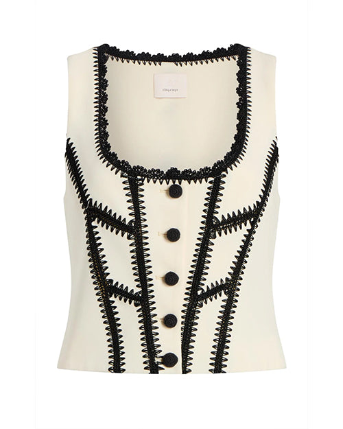 White sleeveless top with black lace and button details on a white background