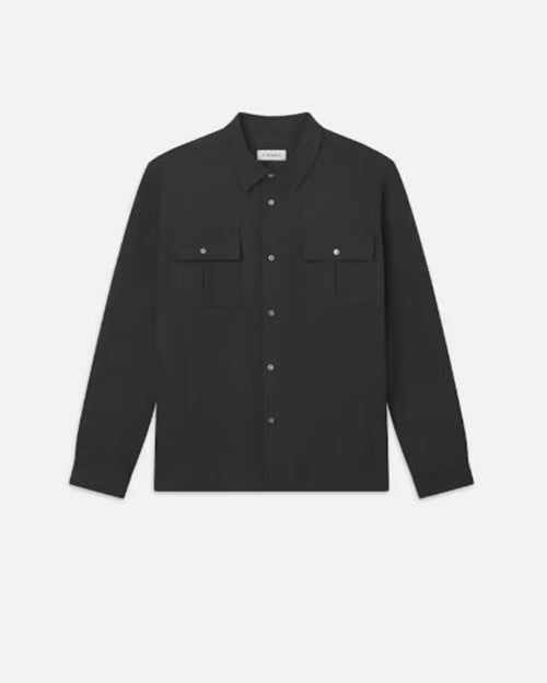 A dark long-sleeve silver button-up shirt with two chest pockets. There is a white rectangular tag on the inner neckline, and the shirt is placed in front of a white background.