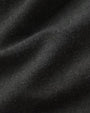 A close-up image of soft dark green fabric.