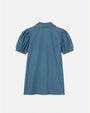 The backside view of a blue denim dress with short, puffed sleeves, a collar, and is placed in front of a white background.