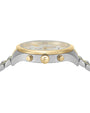 A close-up shot of the side of a luxury wristwatch with a metallic gold and silver band. The crown is engraved with an 'F' in the center.