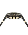 A side view of a black transparent wristwatch with gold accents, including a gold crown with an engraved "F".  The background is plain white.