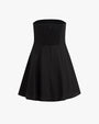 The backside view of a strapless black dress that flares out at the bottom with a zipper running down the back, placed against a white background.