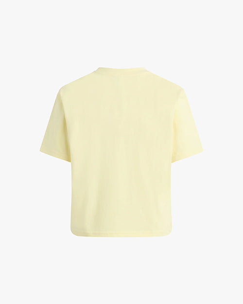 The backside view of a light yellow short-sleeved t-shirt. The background is plain white.