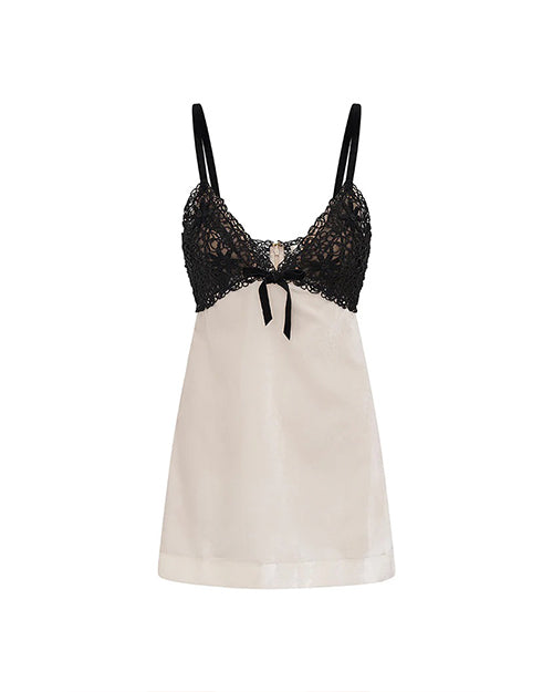 A V-neck dress with thin black straps, black lace detailing, a bow on the upper half, and a white fabric lower section. The background is plain white.