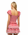 Back view of a person wearing a red and white checkered top and skirt with short puffed sleeves, a smocked fitted bodice, and a tiered ruffled skirt.