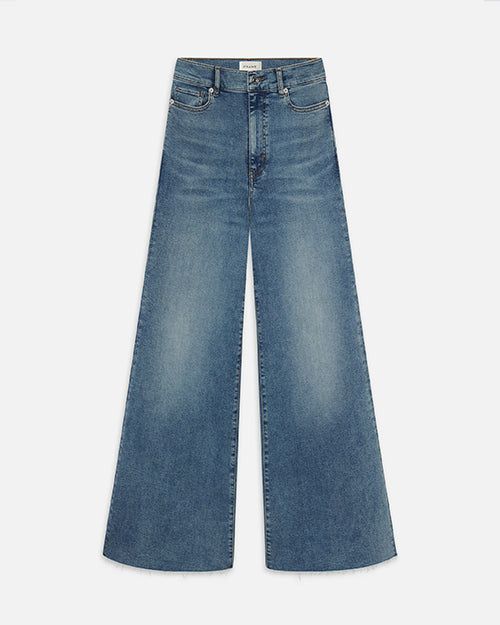 A pair of light blue wide-leg jeans with a slightly faded and worn-in look. The background is plain white.