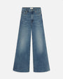 A pair of light blue wide-leg jeans with a slightly faded and worn-in look. The background is plain white.