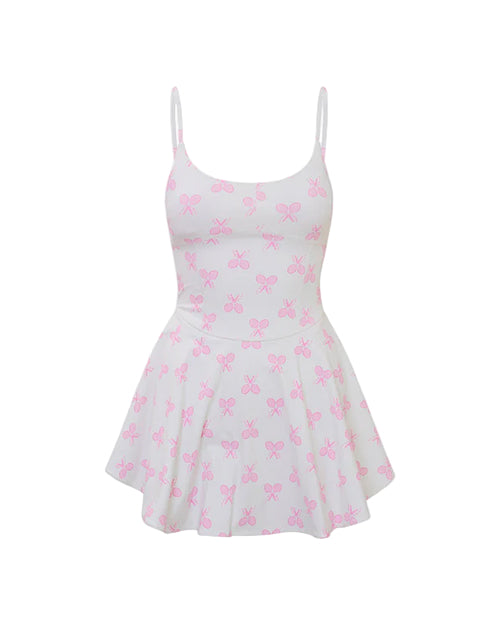 White dress with thin shoulder straps and a flared skirt, featuring a pattern of small tennis racket evenly distributed across the fabric.