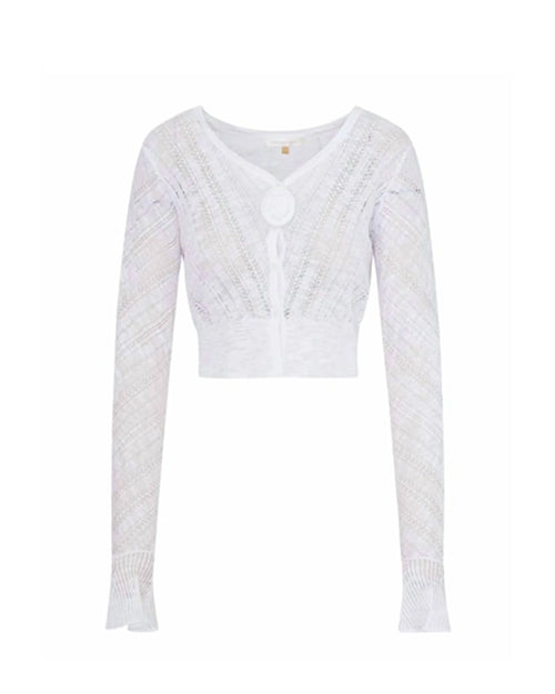 A white, long-sleeved, cropped cardigan with a V-neckline, featuring a delicate, semi-transparent knit pattern and features a large single button closure at the front. The shirt is placed in front of a white background.
