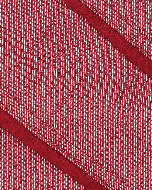 Close-up of red fabric with a textured pattern
