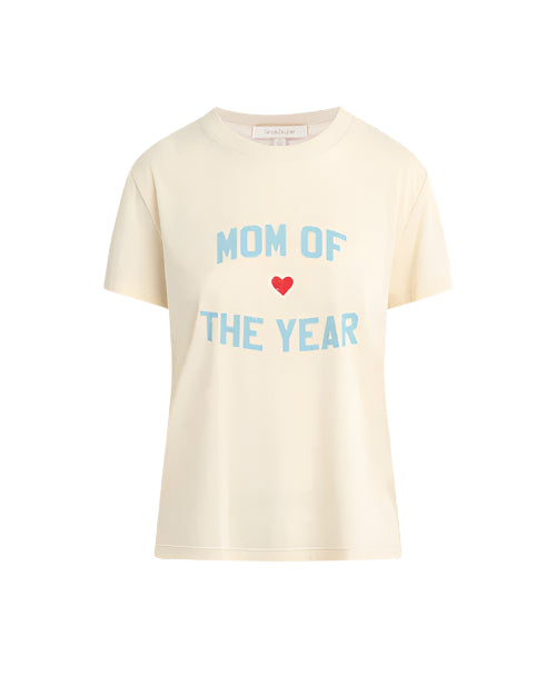 A beige crewneck t-shirt with the text "MOM OF THE YEAR" written in all caps in blue, and a small red heart. There is a white rectangular tag on the inner neckline, and the shirt is placed against a white background.