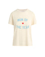A beige crewneck t-shirt with the text "MOM OF THE YEAR" written in all caps in blue, and a small red heart. There is a white rectangular tag on the inner neckline, and the shirt is placed against a white background.