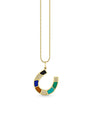 A gold chain necklace with a multi-color horseshoe pendant with a gold outline.
