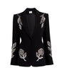 Black blazer with floral embellishments on a white background