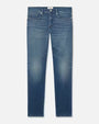 A pair of blue jeans with a faded wash at the knees and a white rectangular tag in the inner waistline. The background is plain white.