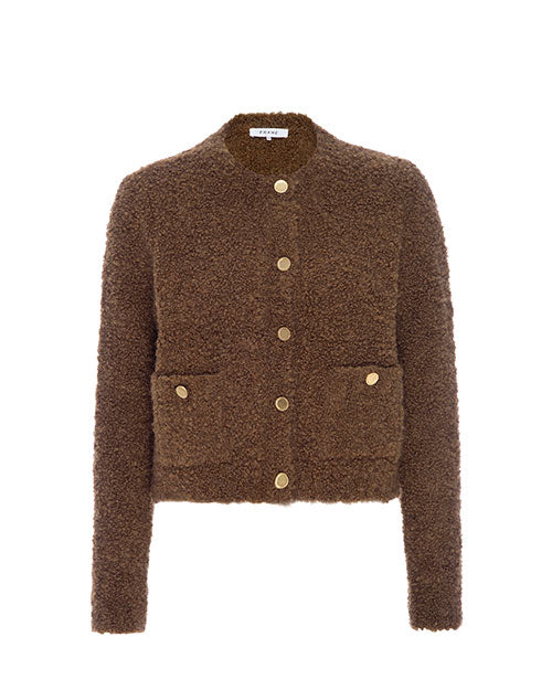 A brown, fuzzy textured cardigan featuring a high round neckline, gold buttons, and two waist pockets. The inner neckline has a white rectangular tag, and the sweater is placed in front of a white background.