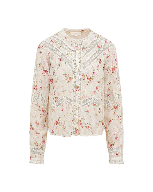 A long-sleeved, floral-patterned blouse with horizontal lace detailing and a lightly ribbed fabric. The blouse has a high neckline with ruffled edges and buttons down the front, with a pattern of small pink flowers and a lace trim at the cuffs. The background is plain white.