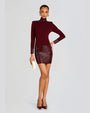 A full body view of a model with her hand on her hips, wearing thick silver hoops, and a dark red dress with long sleeves, a high neckline, and a shiny texture on the skirt, cuffs, and neck. The model is also wearing matching dark red high-heeled shoes, a white clutch, and standing in front of a blank background.