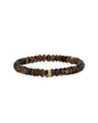 A brown textured beaded bracelet with a gold ring detail adorned with gems in the center. The background is plain white.