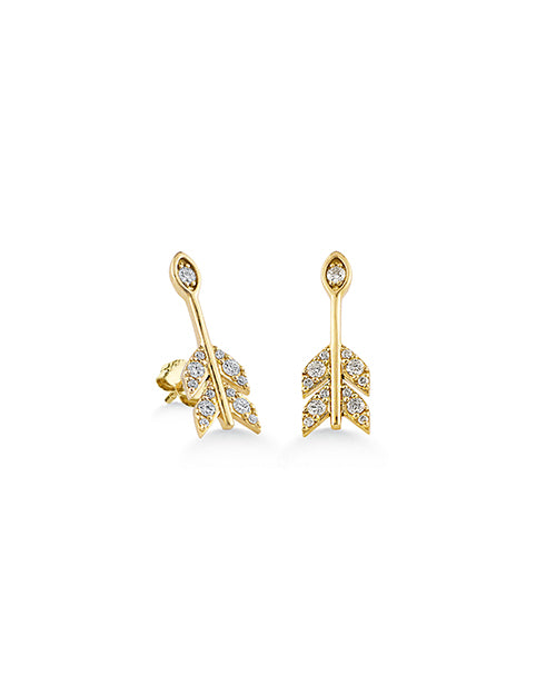 A pair of arrow & feather shaped earrings adorned with jewels. The background is plain and white.