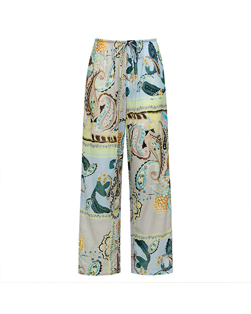 A pair of wide-leg pants with an elastic waistband and drawstring. The pants feature a colorful paisley pattern with shades of blue, green, yellow, and beige.