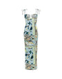 A long form-fitting dress with thin straps and shoulder bows, featuring an empty space design at the chest, and a colorful pattern with various paisley designs. The background is plain white.
