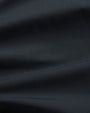 A close-up of soft navy fabric.
