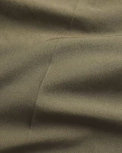 A close-up of green fabric.