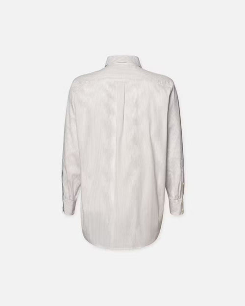 The backside view of a white long-sleeve button-up shirt floating in front of a white background.