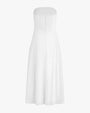 The backside view of a long, strapless white dress with a partially open back with an elastic material and a zipper. The background is white.