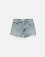 A pair of light-wash denim shorts with frayed ends sitting in front of a white background. The inner waistline has a rectangular white tag with the word "FRAME" on it.