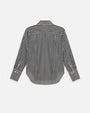 The backside view of a navy and white thin striped button-down shirt in front of a white background.