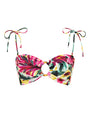A spaghetti strapped bandeau style bikini top with a colorful floral brushstroke pattern. The top is cinched with an O-ring detail in the center, and bows tied at the top of the straps. The background is white.