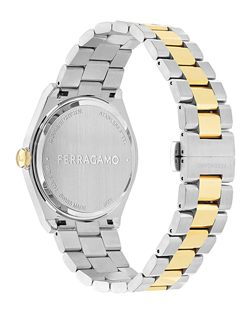 Back view of a Ferragamo luxury wristwatch with a two-tone silver and gold metal band, showing engraved details including 'Sapphire Crystal,' 'Stainless Steel,' 'Water Resistant,' 'Swiss Made,' and '5ATM'.