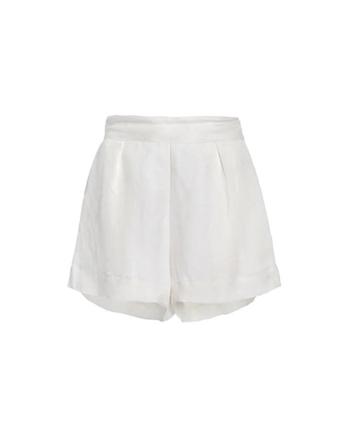 A pair of white linen shorts placed on a white background.