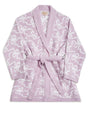 A soft purple bathrobe with a thin white bows pattern. The bathrobe has long sleeves, a shawl collar, and a matching pink belt tied around the waist, placed behind a white background.