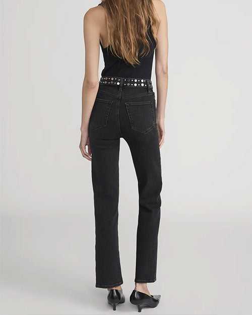 Back view of high-waisted black jeans with straight legs, paired with a black studded belt and black sleeveless top.