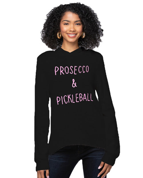 Model wearing Prosecco & Pickleball cashmere sweater on a white background.