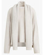 A light-colored, long-sleeved sweater with a matching scarf and ribbed cuffs. The background is plain white.