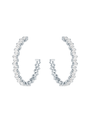 A pair of silver hoop earrings encrusted with small, clear gemstones which are slightly zigzag set. The background is white.