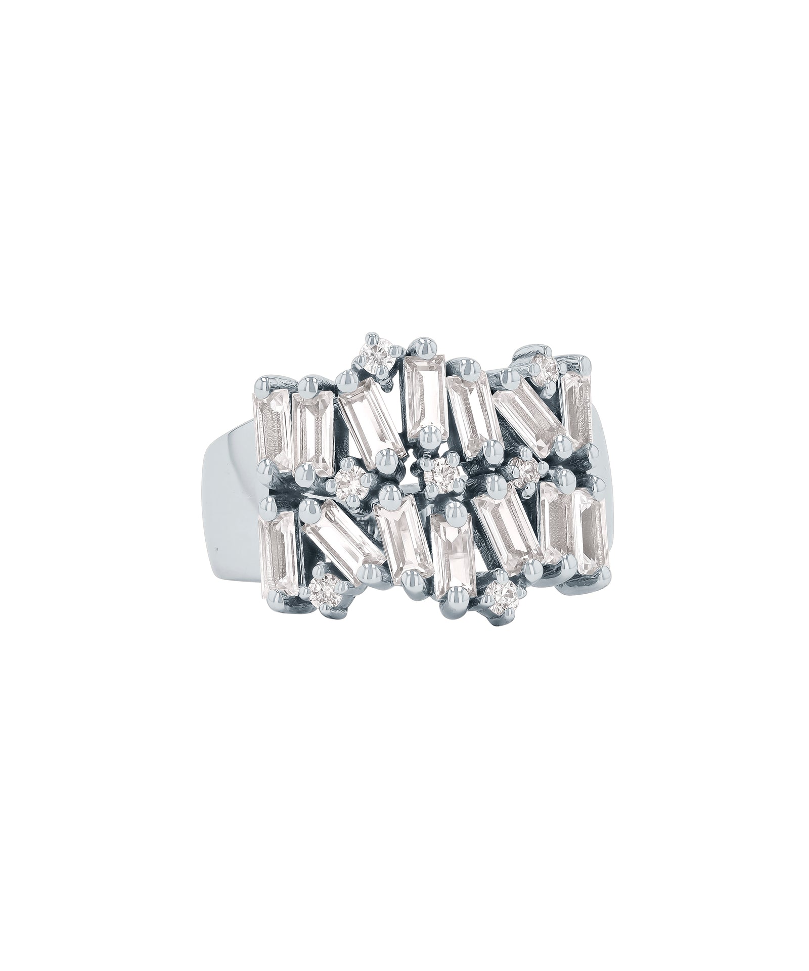 A silver ring with multiple rectangular and round-cut diamonds arranged in a clustered pattern on the band. The background is white.