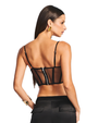 A knee-up backside view of a brunette model with her hair swept back, wearing a cropped, black, thin strapped sheer corset-style top with black cargo pants, square gold earrings and a gold bracelet. The background is plain white.